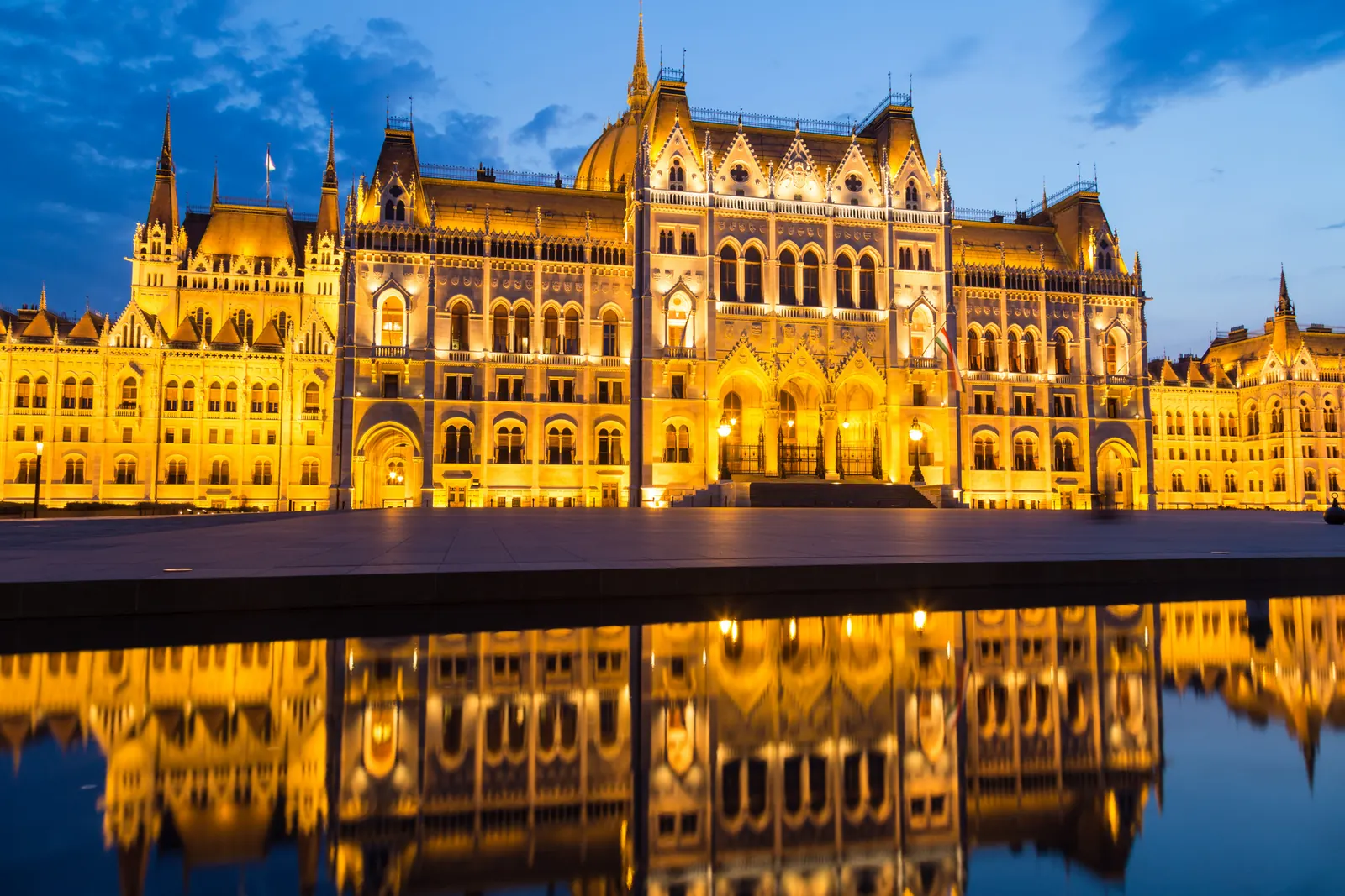 Budapest Parliament illuminated beside the river
